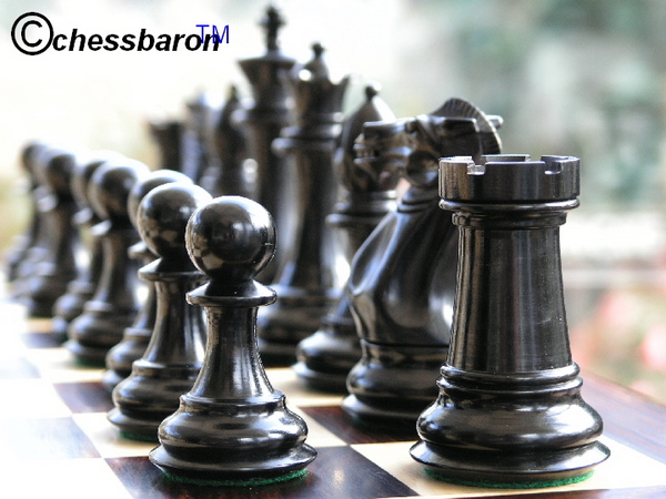 Luxury wooden chess pieces showing the contrasting grain and colour of ebony and rosewood