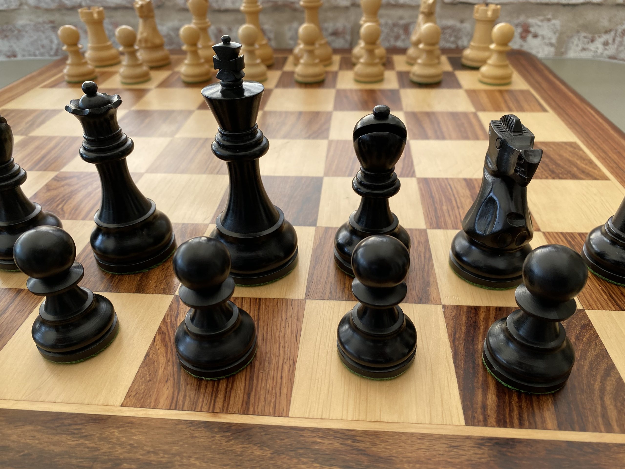 A group of chess pieces sitting on top of a chess board photo